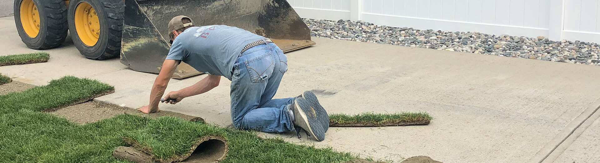 Man Laying Down Sod